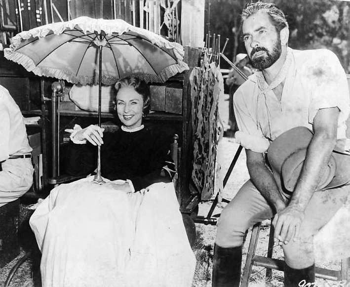 033-agnes-moorehead-theredlist-Agnes Moorehead and Tyrone Power on the set of Utamed directed by Henry King, 1955