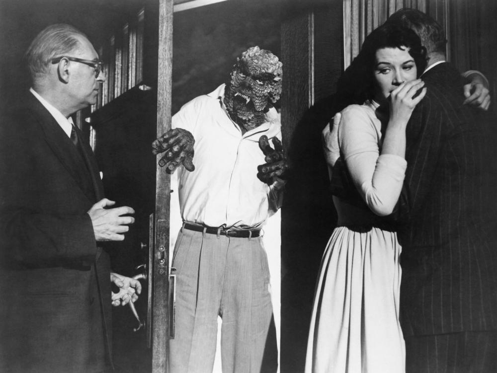 THE HIDEOUS SUN DEMON, Robert Clarke (in doorway), Patricia Manning (second from right), 1959